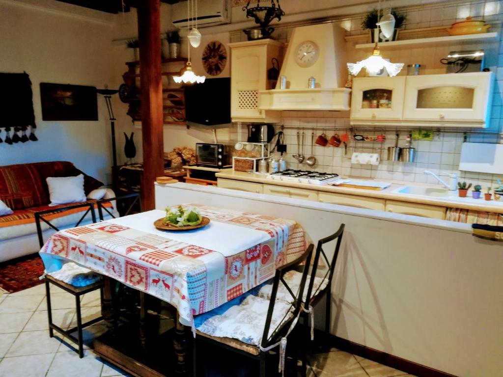 a kitchen with a table with a plate of food on it at La Corte in Venice