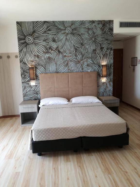 Postel nebo postele na pokoji v ubytování Hotel Excelsior