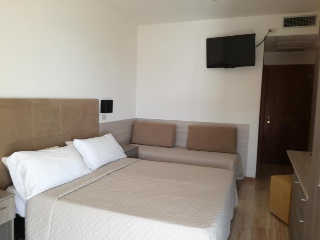 Postel nebo postele na pokoji v ubytování Hotel Excelsior