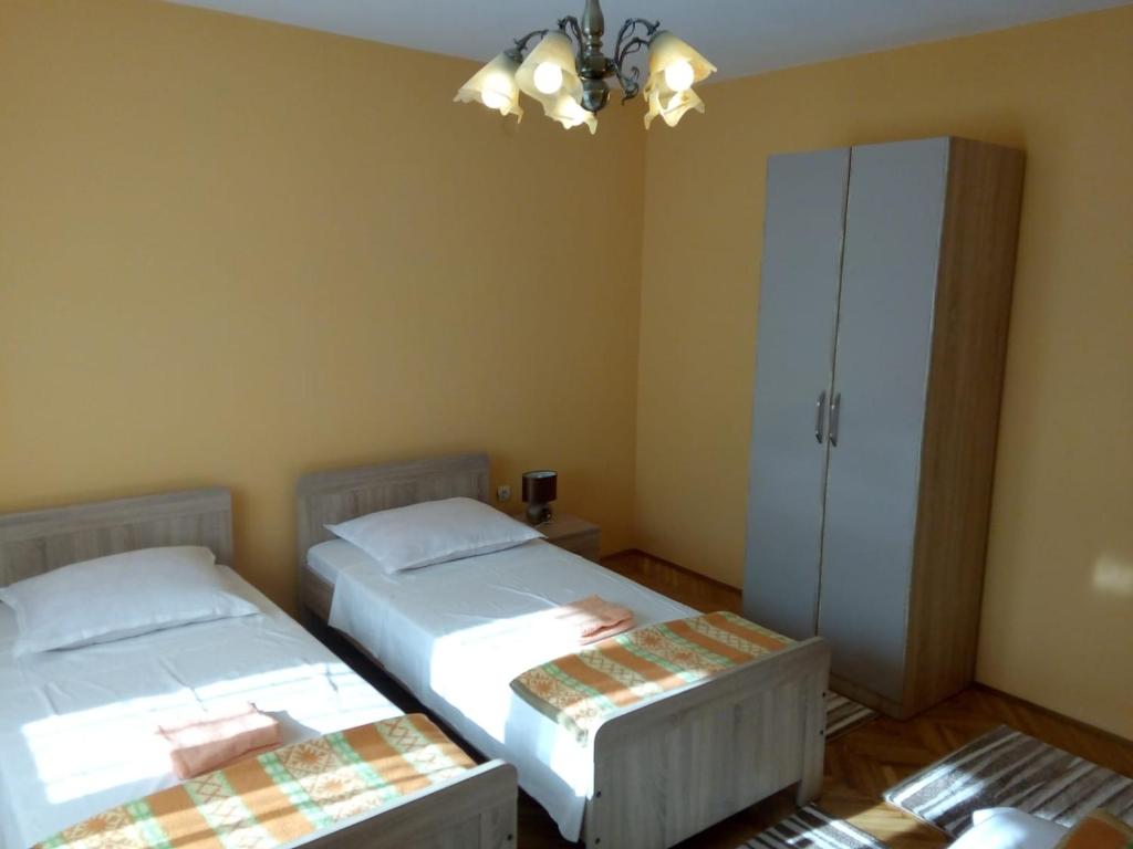 Postel nebo postele na pokoji v ubytování Apartment Singa