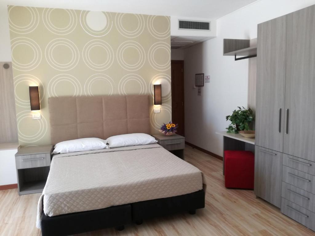 Postel nebo postele na pokoji v ubytování Hotel Excelsior