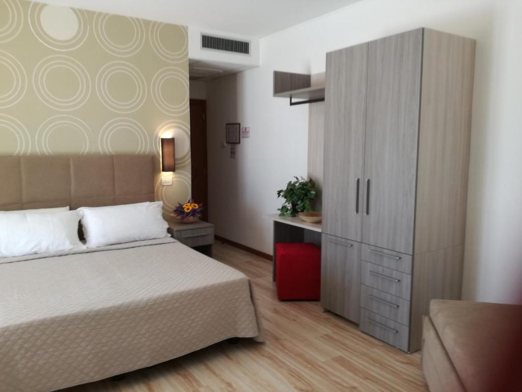 Postel nebo postele na pokoji v ubytování Hotel Excelsior