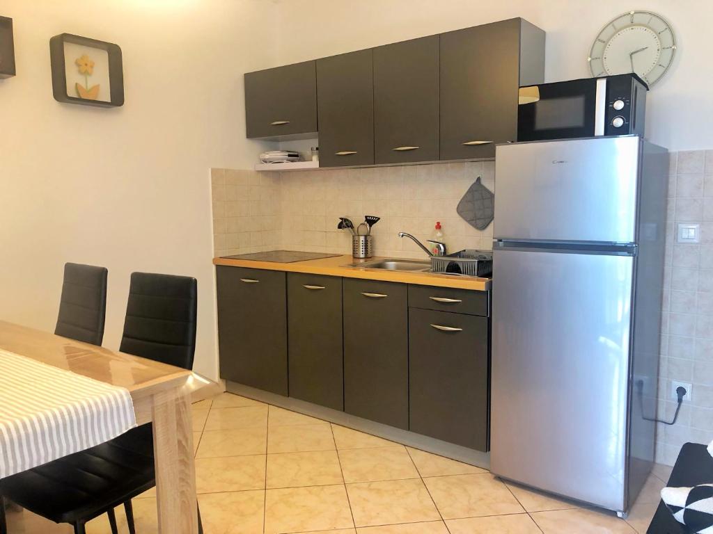 Kuchyň nebo kuchyňský kout v ubytování Apartment Rabac