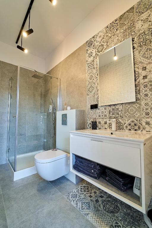 Kúpeľňa v ubytovaní Apartamenty Muzyczna 14