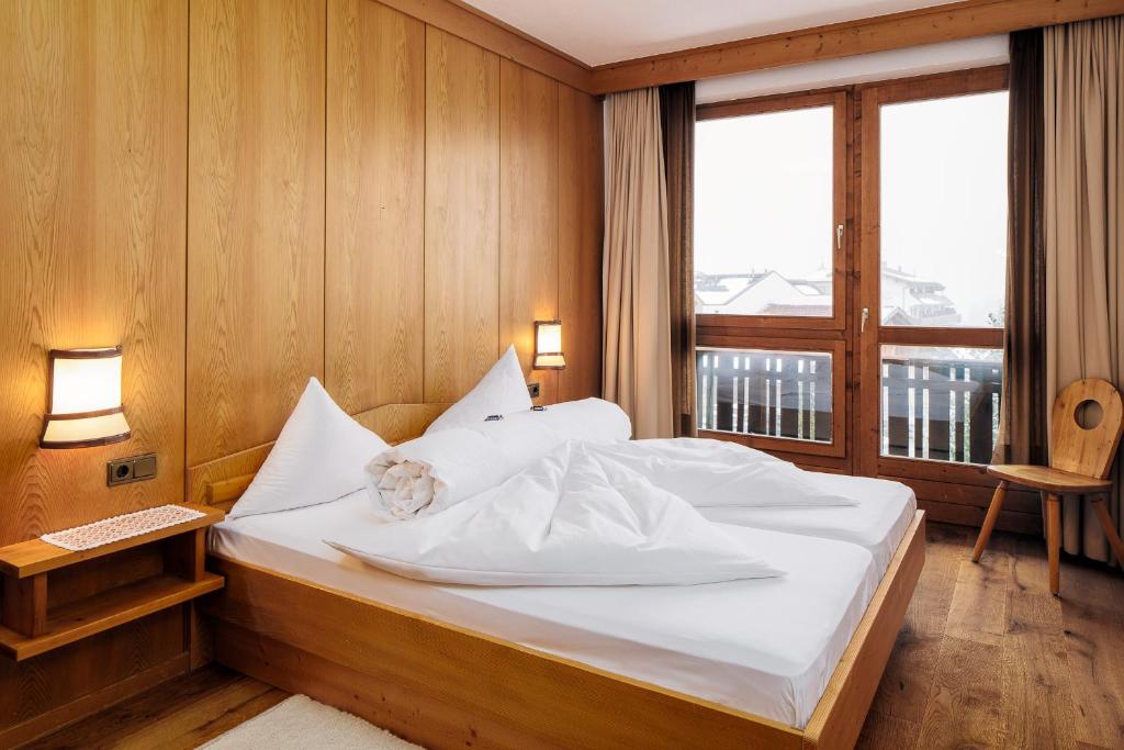 Postel nebo postele na pokoji v ubytování Hotel Komperdell