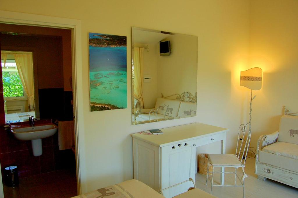 Postel nebo postele na pokoji v ubytování Hotel Budoni Beach