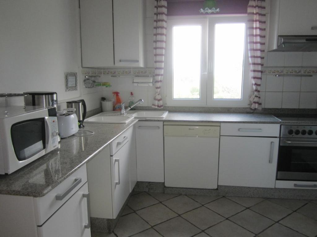 Kuchyň nebo kuchyňský kout v ubytování Infincavacations Chalet y Apartamentos