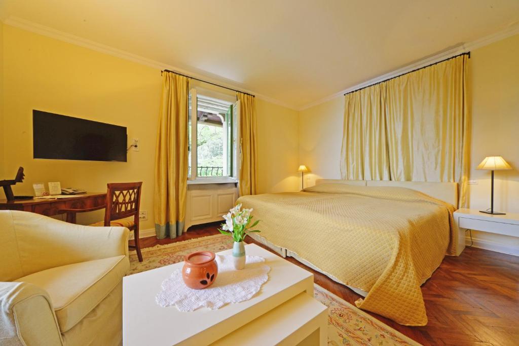 Postel nebo postele na pokoji v ubytování Hotel Villa Astra