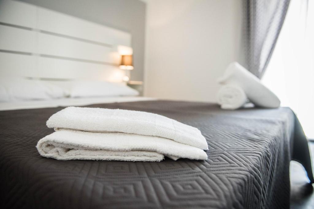A bed or beds in a room at L'ANTICO FONDACO