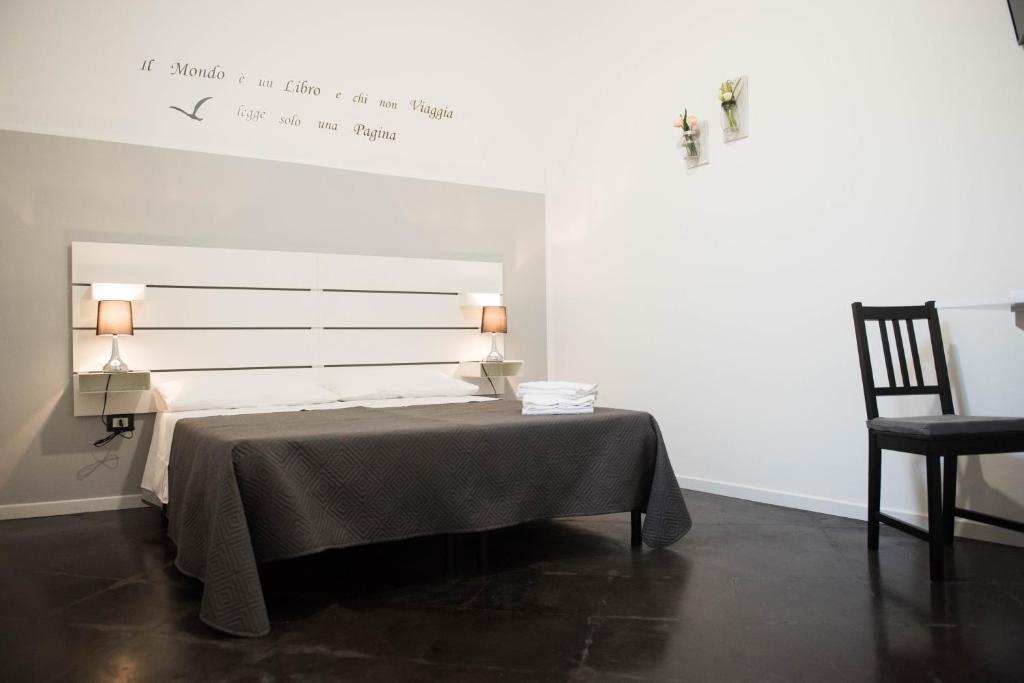A bed or beds in a room at L'ANTICO FONDACO