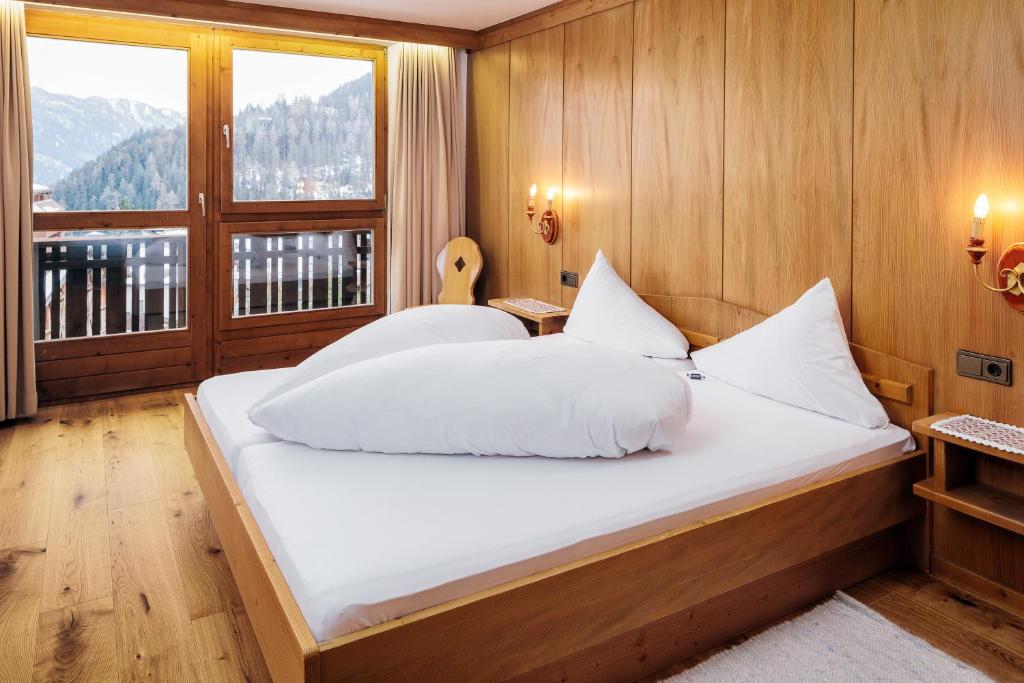 Postel nebo postele na pokoji v ubytování Hotel Komperdell