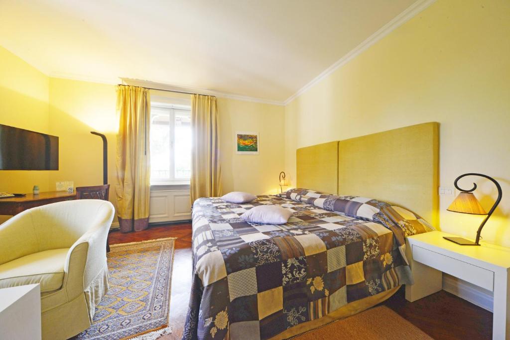 Postel nebo postele na pokoji v ubytování Hotel Villa Astra