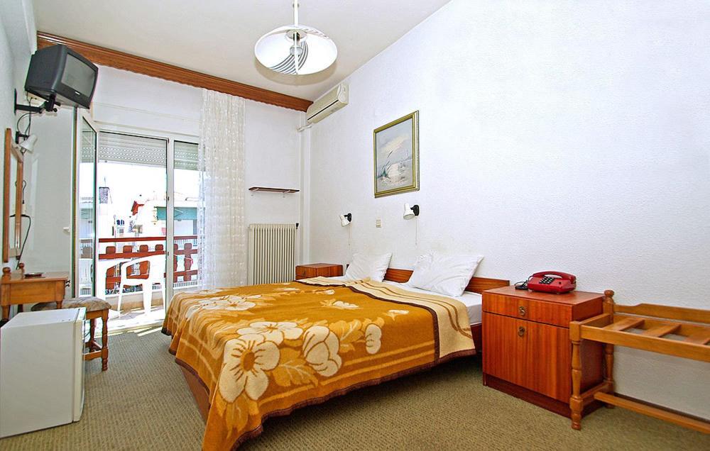 Postel nebo postele na pokoji v ubytování Hotel Helios