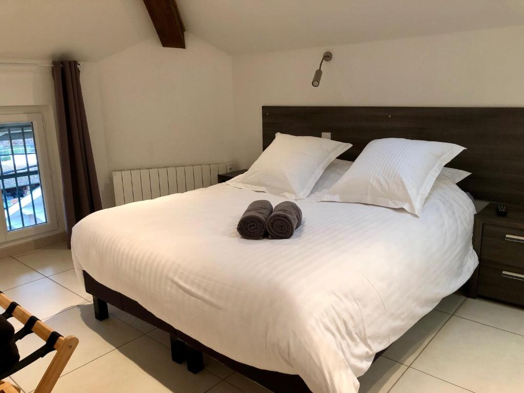 Ένα ή περισσότερα κρεβάτια σε δωμάτιο στο La Colombine