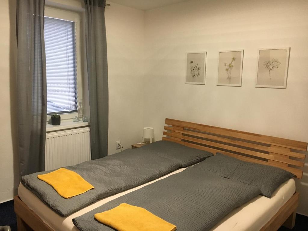 Postel nebo postele na pokoji v ubytování Mikulov Inn - hotel Zeme
