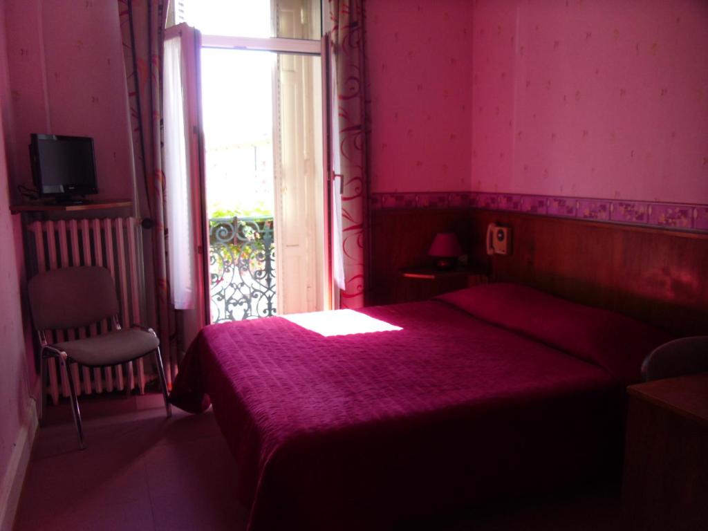 Postel nebo postele na pokoji v ubytování Hôtel De Bale