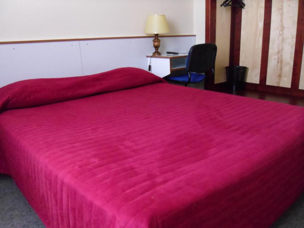 Postel nebo postele na pokoji v ubytování Hôtel De Bale