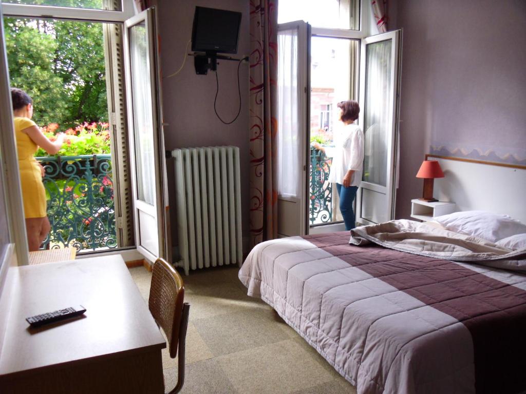 Postel nebo postele na pokoji v ubytování Hôtel De Bale