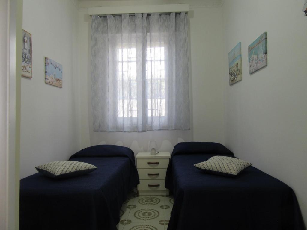 A bed or beds in a room at Villa Oltremare By Cala Salento
