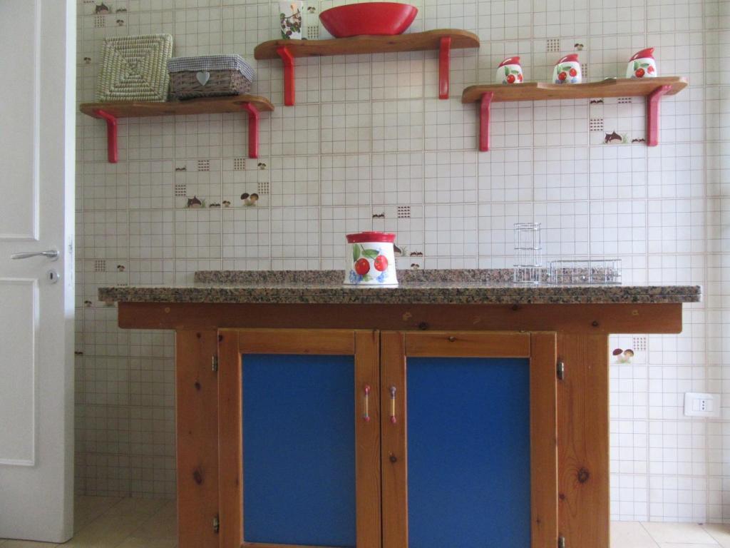 A kitchen or kitchenette at Villa Oltremare By Cala Salento