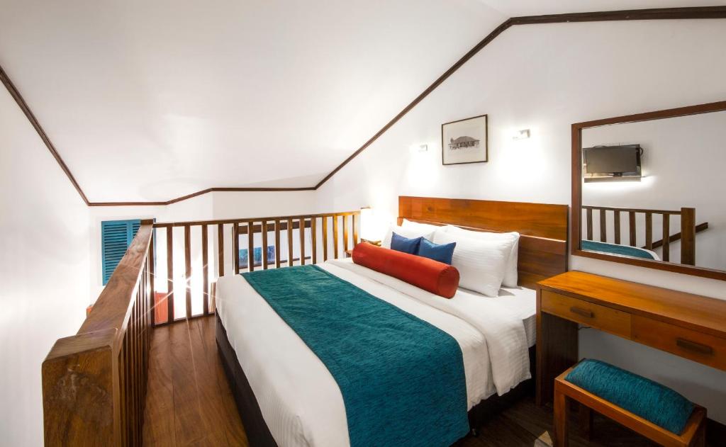 Postel nebo postele na pokoji v ubytování Tangerine Beach Hotel