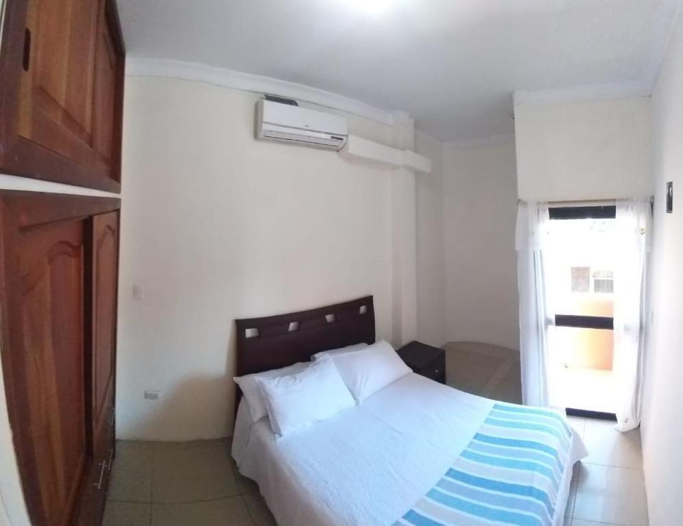 Postel nebo postele na pokoji v ubytování Hostal Duncan