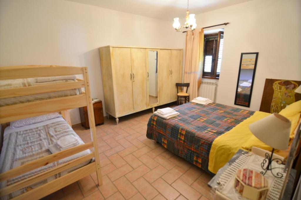 Postel nebo postele na pokoji v ubytování Agriturismo Cailuca