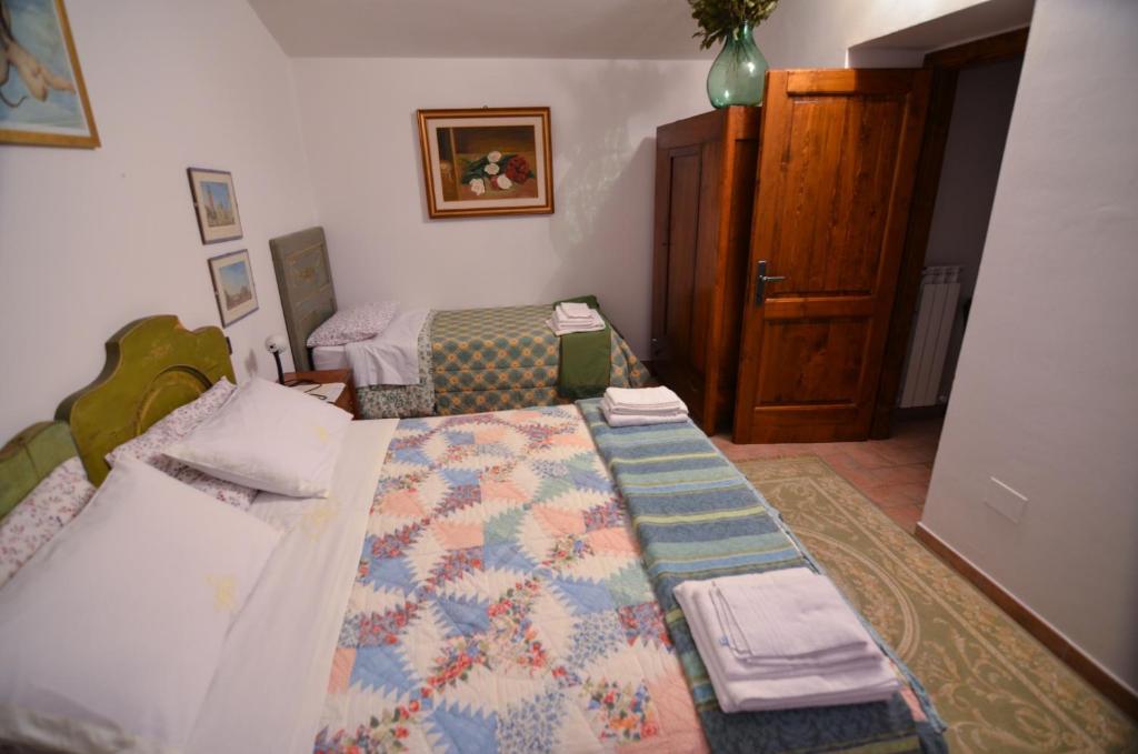 Postel nebo postele na pokoji v ubytování Agriturismo Cailuca