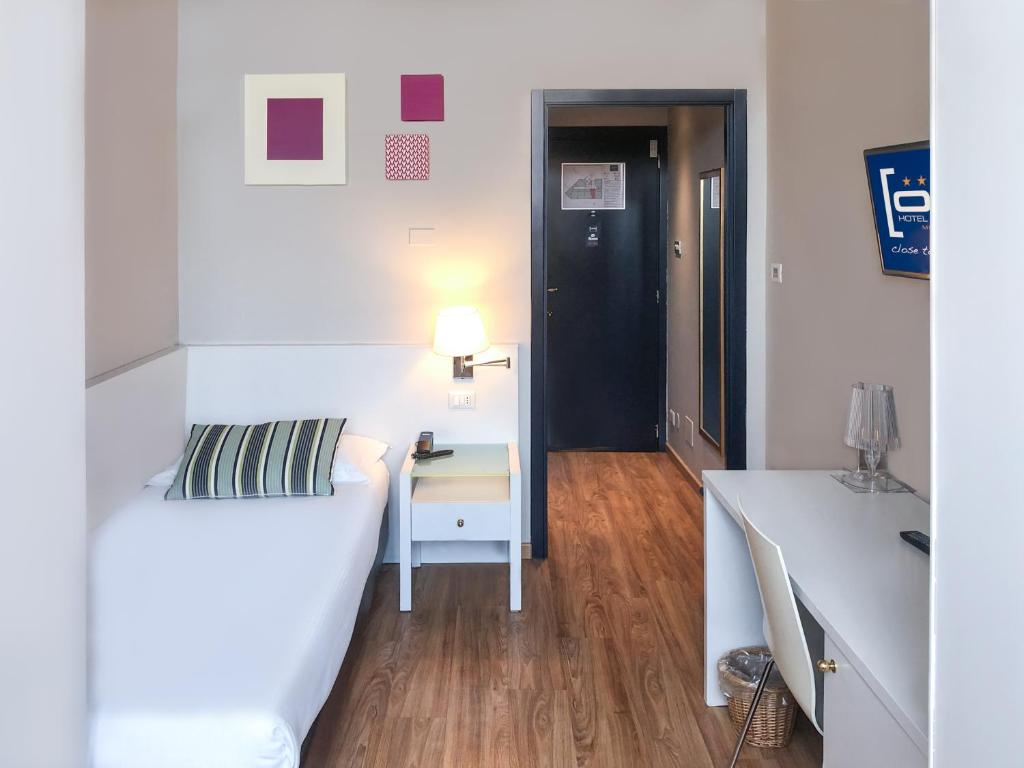 Postel nebo postele na pokoji v ubytování Hotel Oro Blu