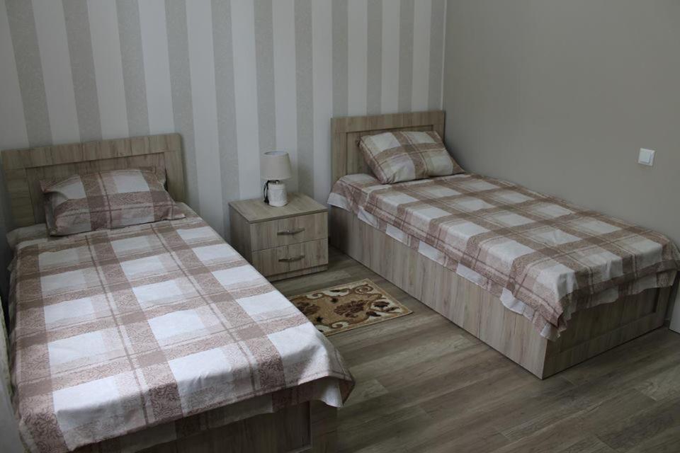 Rúm í herbergi á Guest House Lviv Грузия