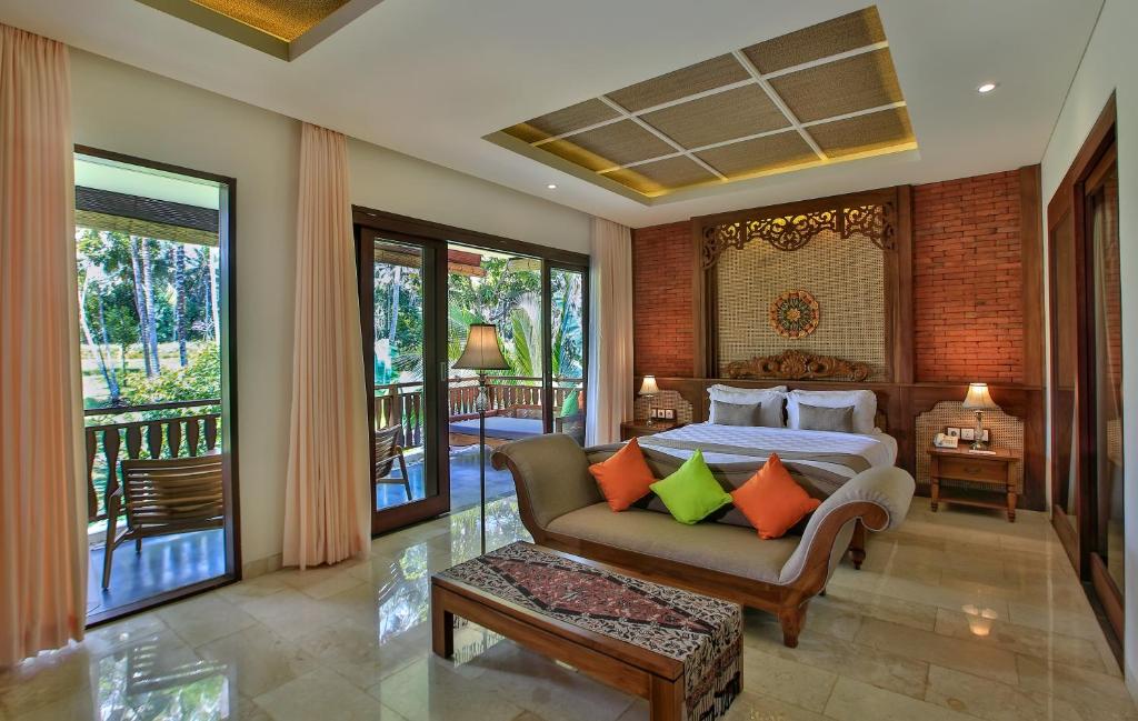 Postel nebo postele na pokoji v ubytování Green Field Resort Ubud