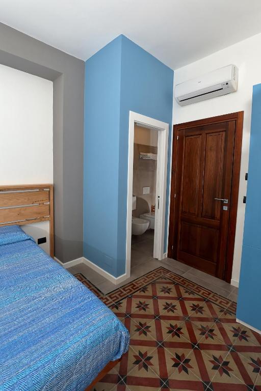 Postel nebo postele na pokoji v ubytování Timpa rooms