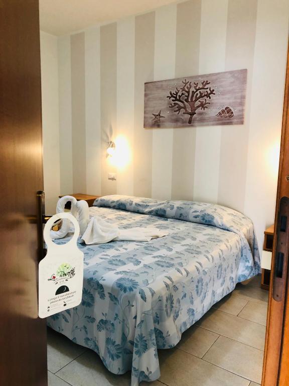 Postel nebo postele na pokoji v ubytování Hotel La Rosetta Scauri