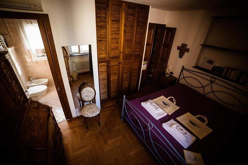 Postel nebo postele na pokoji v ubytování Camere Nicolina