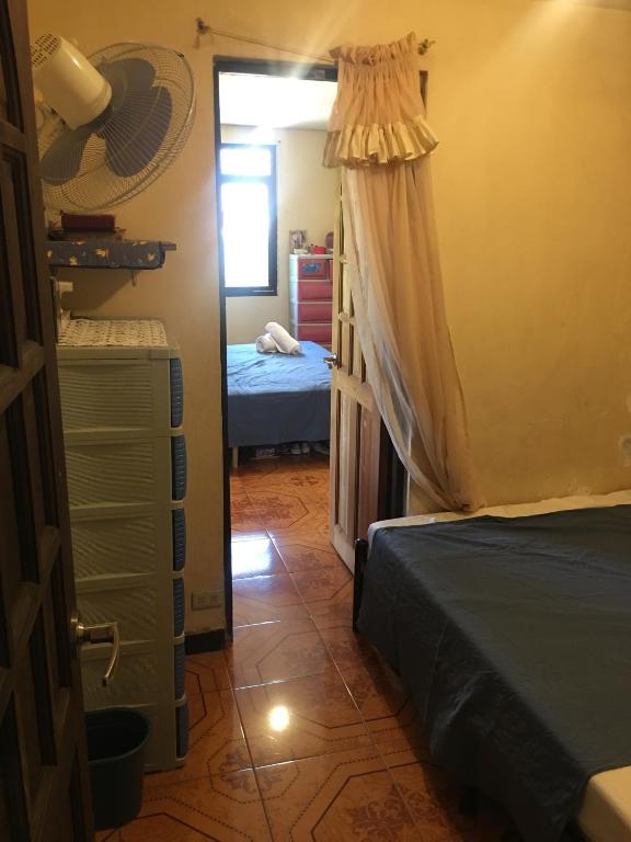 Postel nebo postele na pokoji v ubytování Guesthouse Cavite