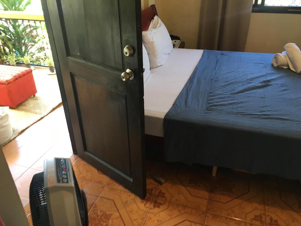 Postel nebo postele na pokoji v ubytování Guesthouse Cavite
