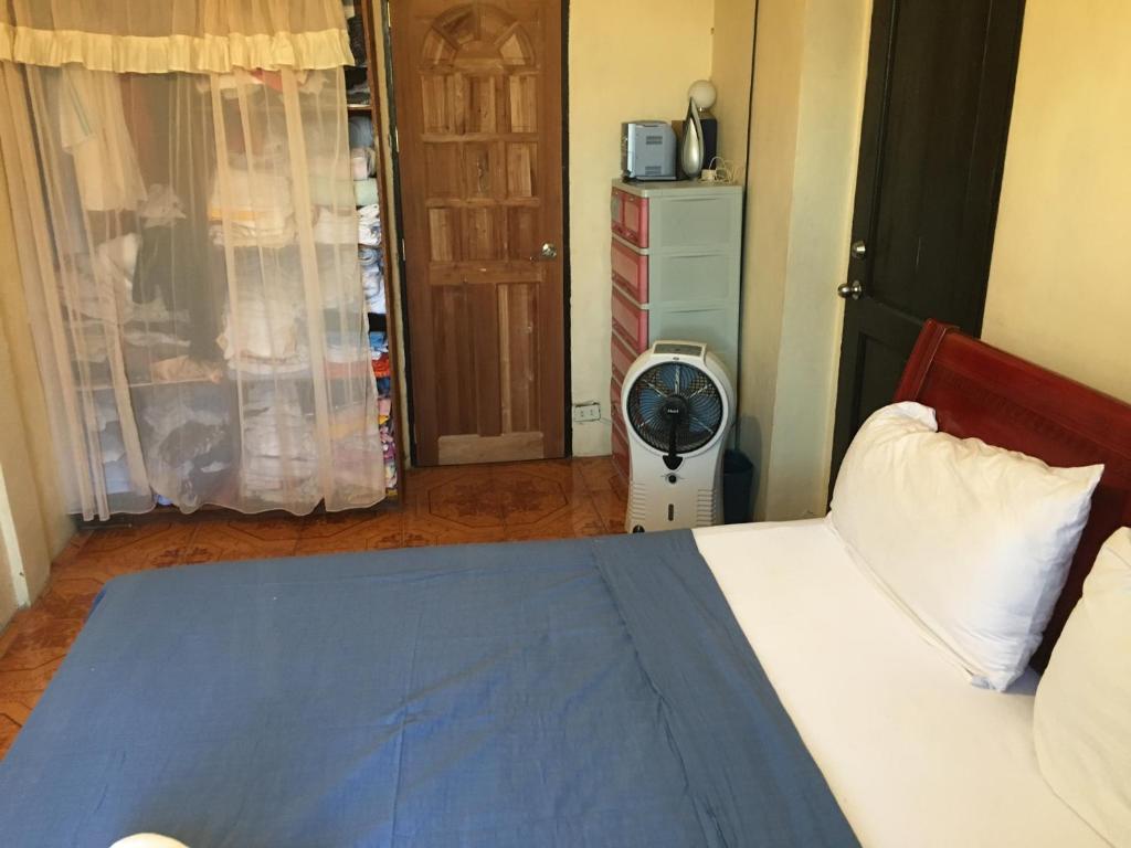 Postel nebo postele na pokoji v ubytování Guesthouse Cavite