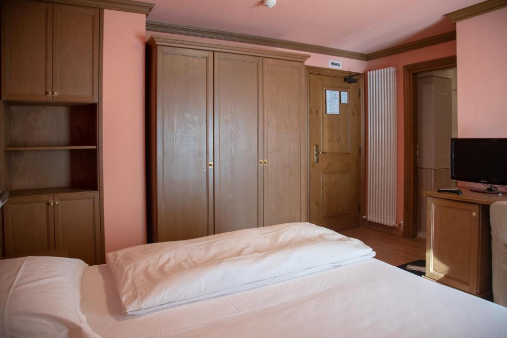 Postel nebo postele na pokoji v ubytování Hotel Compagnoni