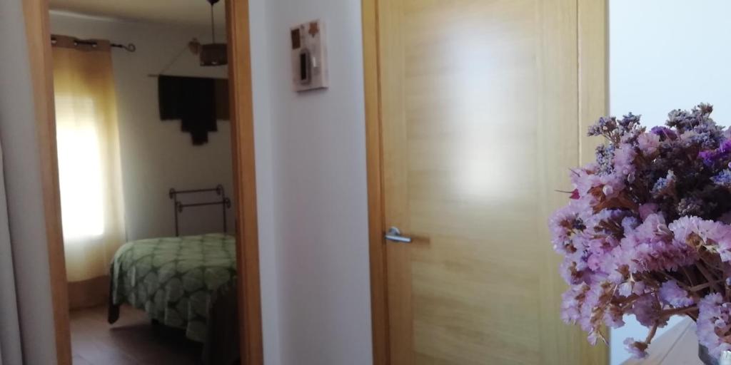 A bed or beds in a room at El Duende del Tejar