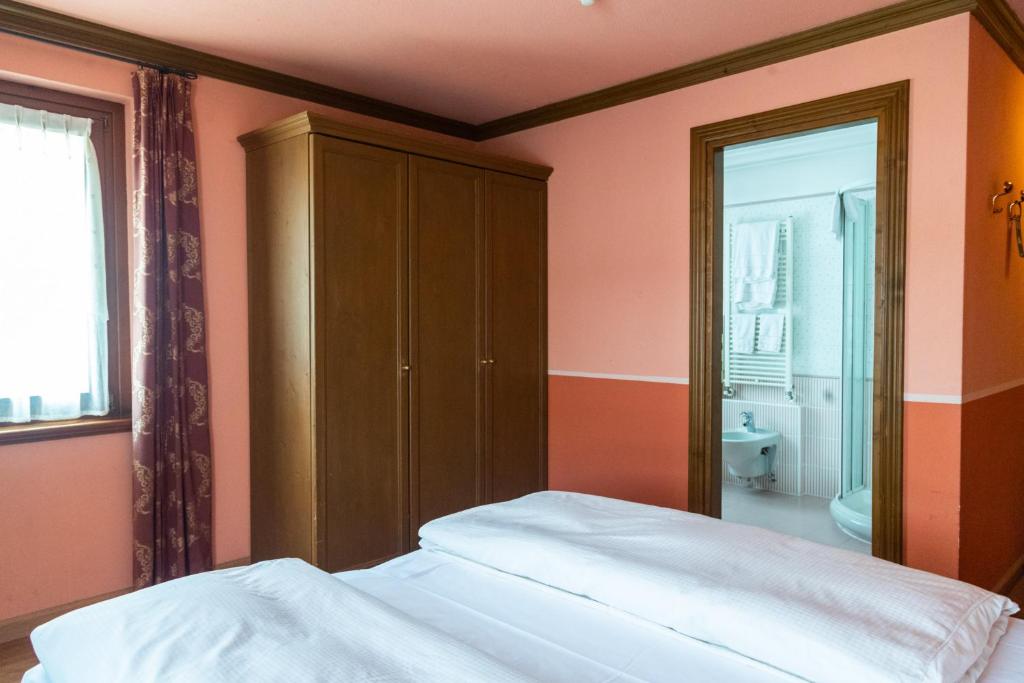 Postel nebo postele na pokoji v ubytování Hotel Compagnoni