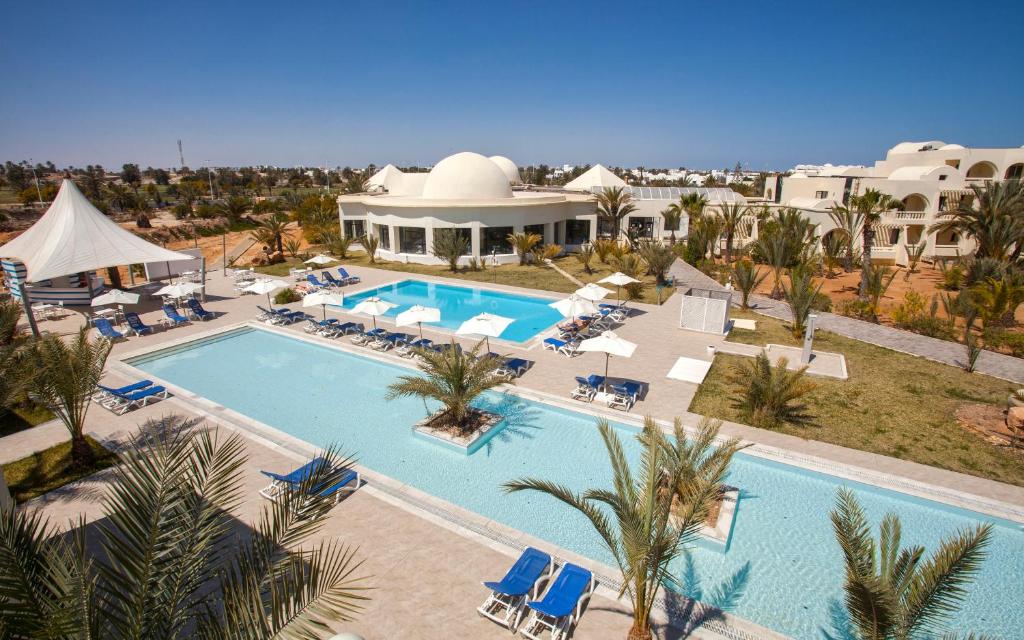 an aerial view of a resort with a swimming pool at Cesar Thalasso in Midoun