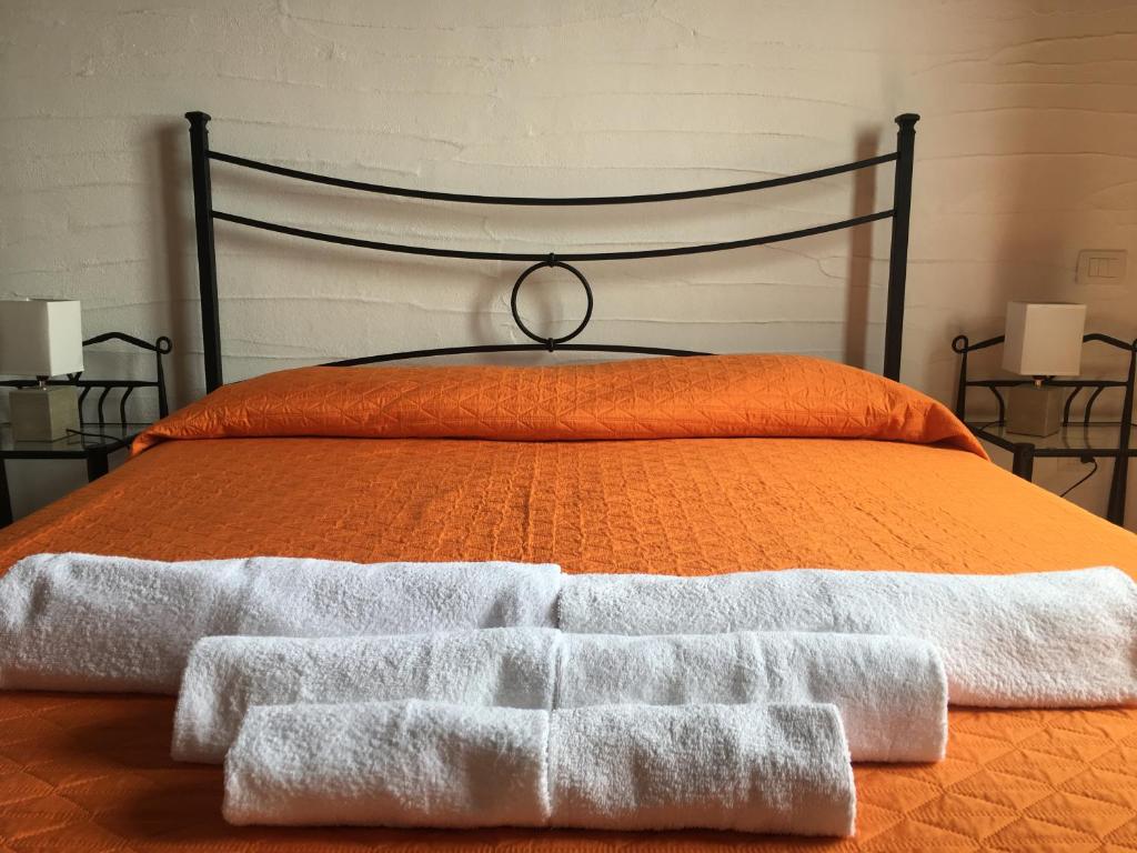 A bed or beds in a room at La Villa Tanca Piras