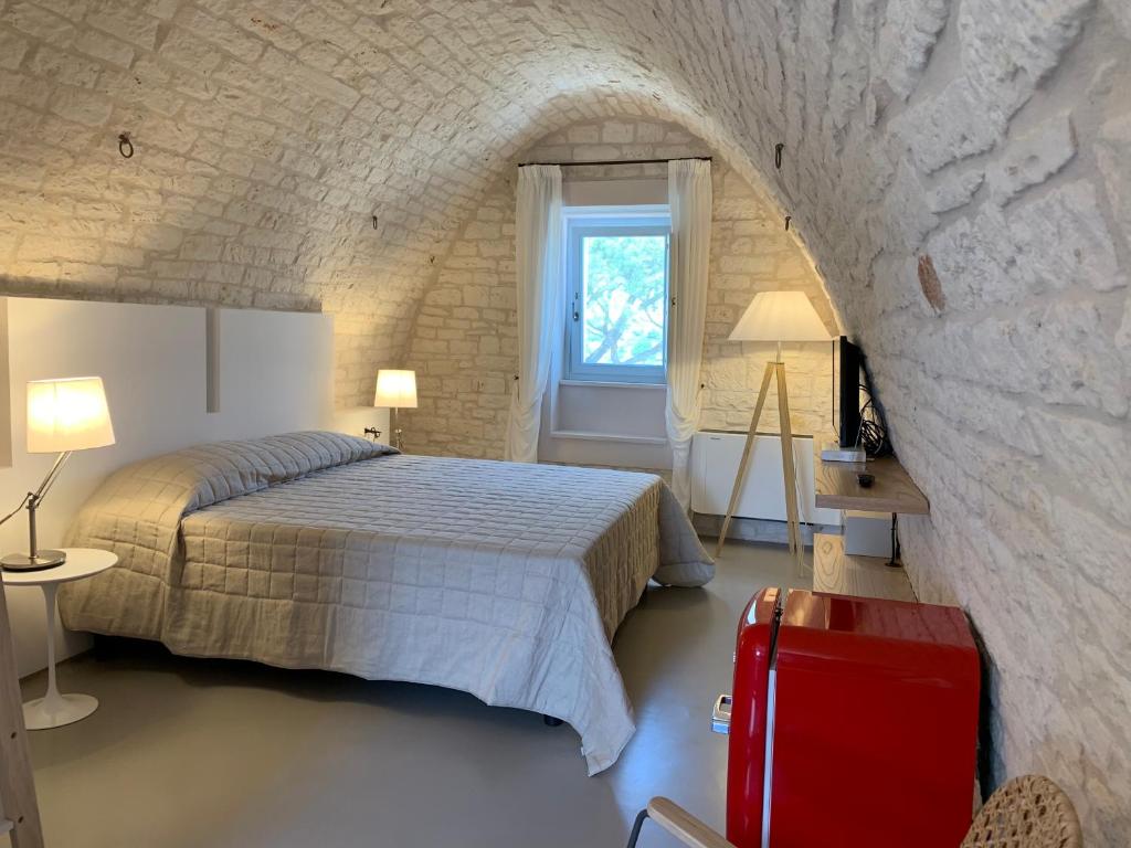 Postel nebo postele na pokoji v ubytování Masseria Grofoleo