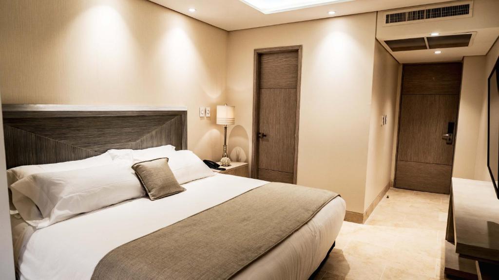 Postel nebo postele na pokoji v ubytování Hotel Boutique Maree