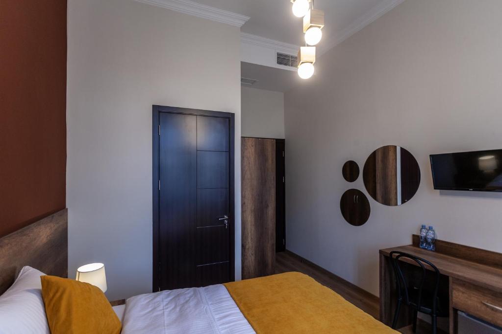 Postel nebo postele na pokoji v ubytování Hotel Avenue 106