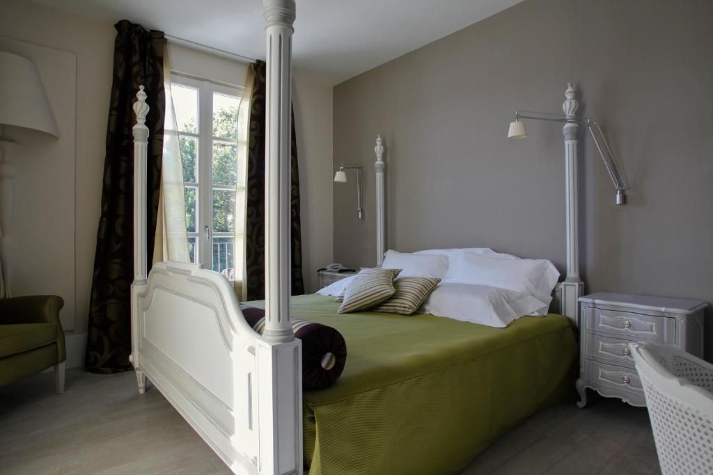 Postel nebo postele na pokoji v ubytování Hotel Arancioamaro