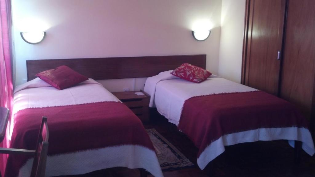 Postel nebo postele na pokoji v ubytování Aparthotel Avenida