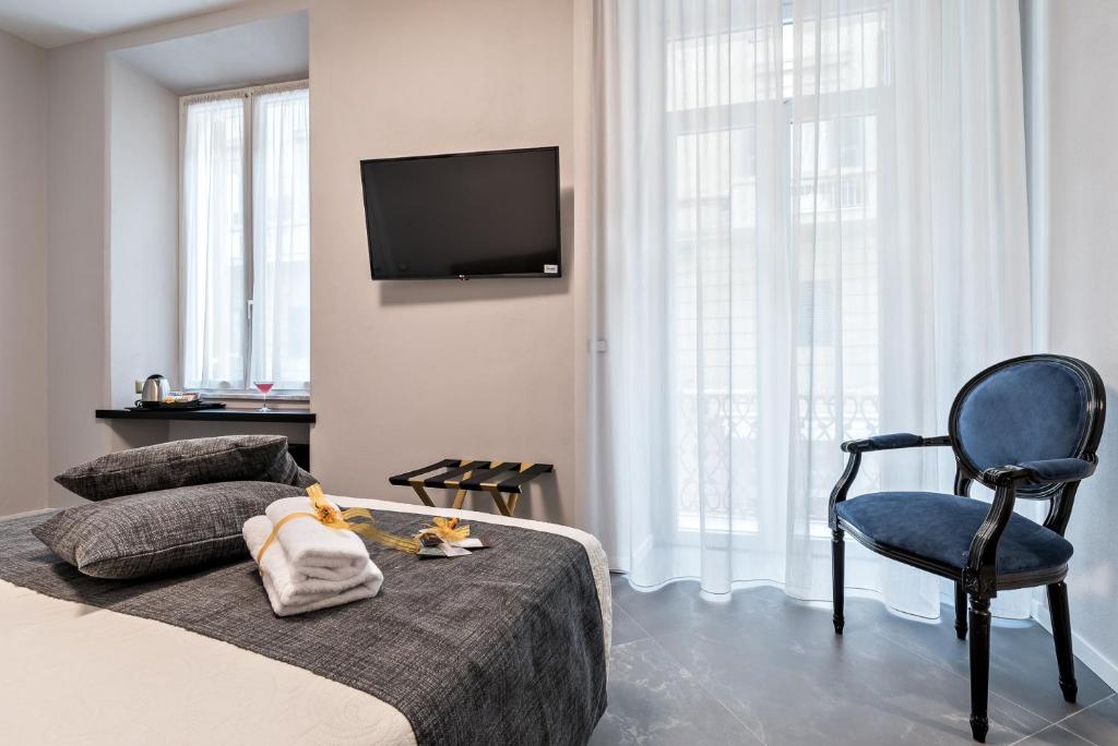 Televízia a/alebo spoločenská miestnosť v ubytovaní Benso Rooms