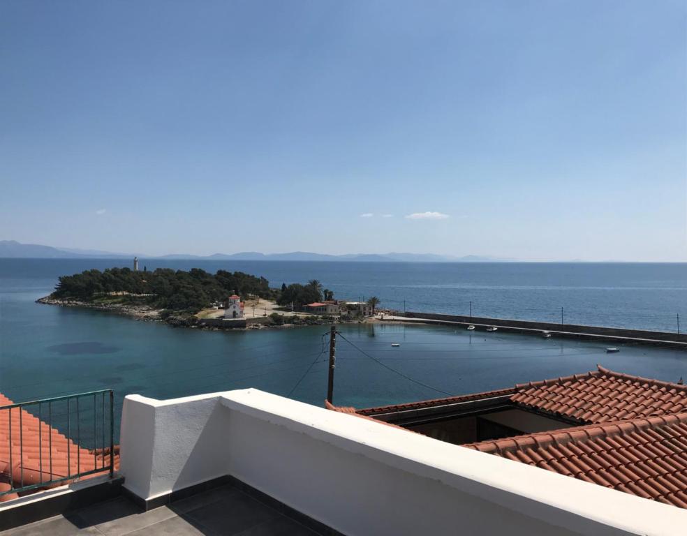 a view of the ocean from the balcony of a house at Casa Laryssiou in Gythio