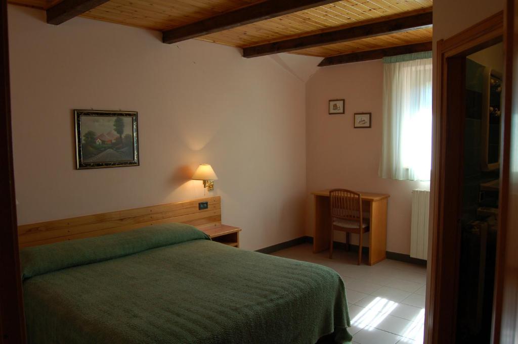 Postel nebo postele na pokoji v ubytování hotel lo sciatore